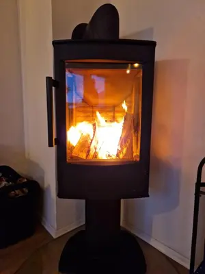 a stove with a fire inside of it at Granåsen World Championship Stay Walk to Ski Arena in Trondheim