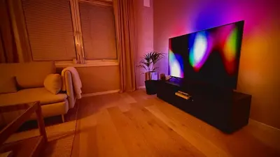 a living room with a television and a couch at Delicate Central Apartment Trondheim in Trondheim