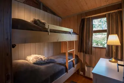 a bedroom with two bunk beds in a cabin at Trysilfjellet Sør 17 in Trysil