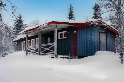 a small cabin in the snow with snow around it at Trysilfjellet Nord 1017 in Trysil