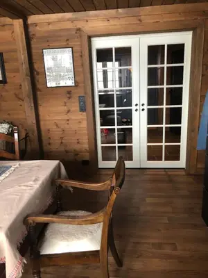 a chair in a room with a bed and a window at Wonderful Ski-In, ski-out Cabin at Kvitfjell in Strande