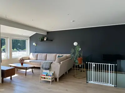 a living room with a couch and a table at Granåsen ski-VM in Trondheim