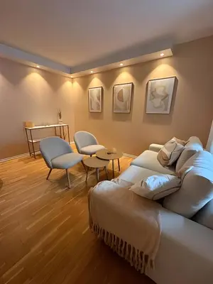 a room with a bed and a table and chairs at Modern and chic city apartment - Bergen City in Bergen