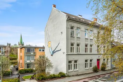 a building with a mural on the side of it at Beautiful and central apartment for rent during Ski WC 2025 in Trondheim