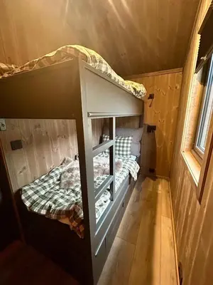 a bunk bed in a tiny house at Norefjell! Newly built cabin with stunning view in Noresund