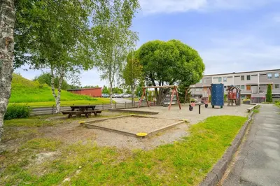 a park with a playground and a picnic table at Spacious and Peaceful Home with a Private Gym in Trondheim