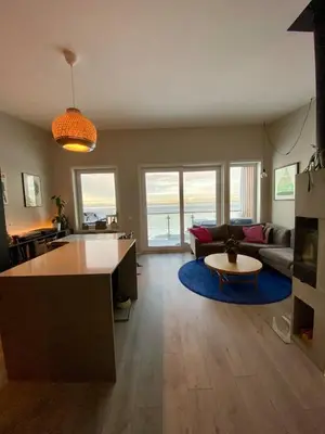 a living room with a couch and a table at Hus til leie under VM 2025 in Trondheim