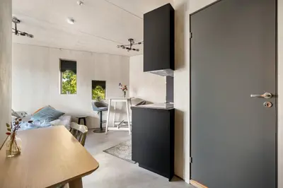 a room with a kitchen and a dining room at Architectural Studio I Private Balcony in Bergen