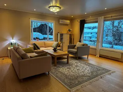 a living room with a couch and two chairs and a table at World championship ski 2025-Cozy house for rent in Trondheim