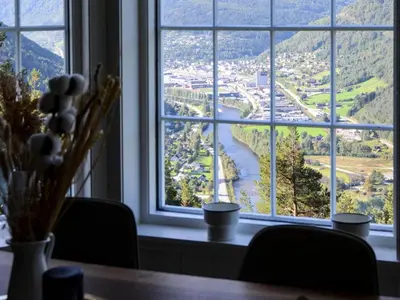 a table with a view of a river from a window at ThePearl in Sel