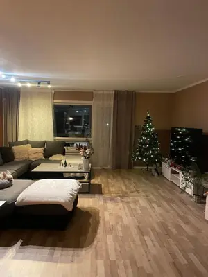 a living room with a christmas tree and a couch at 2 etasjers leilighet in Trondheim