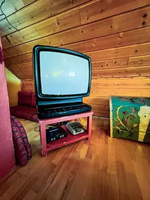 a tv sitting on a table in a room at TheHideaway in Sel