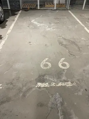 a parking lot with a peace sign painted on it at Apartment Sjusjøen in Sjusjøen
