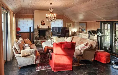 a living room with two couches and a fireplace at 4 Bedroom Beautiful Home In Hemsedal in Hemsedal