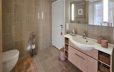 a bathroom with a sink and a toilet and a mirror at 4 Bedroom Beautiful Home In Hemsedal in Hemsedal