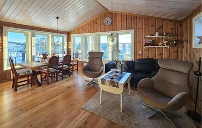 a living room with a couch and a table at Amazing Home In Eggedal With Sauna in Eggedal