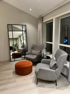 a living room with two chairs and a table at Villa til leie under SKI-VM in Trondheim