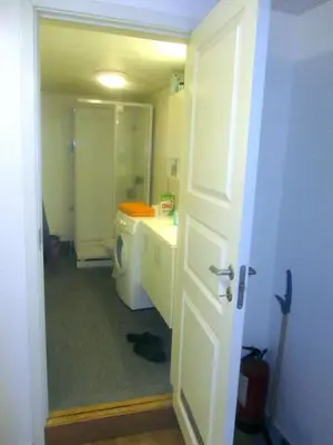 a bathroom with a sink and a washing machine at Trondhjemsvegen in Gjøvik