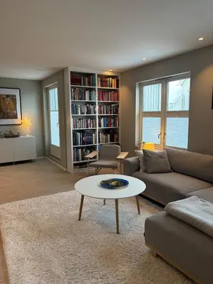 a living room with a couch and a coffee table at Beautiful house - walking distance of everything in Trondheim