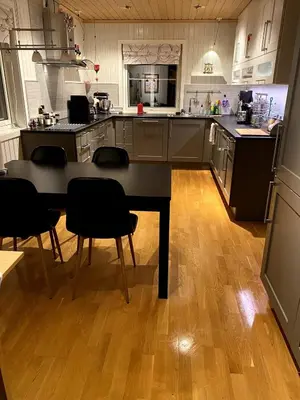 a large kitchen with a table and chairs in it at Large single-family home for rent World Cup 2025 in Trondheim