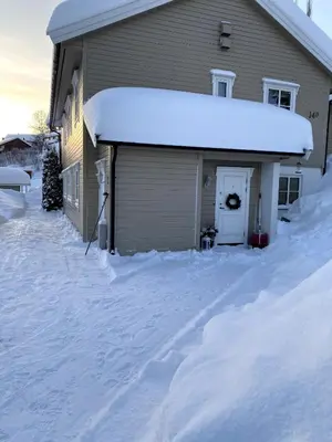 a house covered in snow with a garage at Large single-family home for rent World Cup 2025 in Trondheim