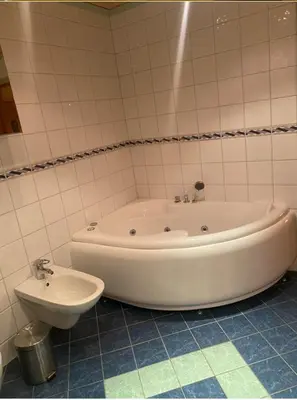a bath tub and a sink in a bathroom at Large single-family home for rent World Cup 2025 in Trondheim