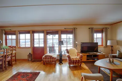 a living room with a couch and a tv at Perfectly Located-Close To Ski Slopes And Hiking Trails in Beitostøl