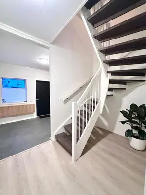 a white staircase in a living room with a potted plant at Kolsåsbakken, Granåsen, Nordic Ski World Championships in Trondheim