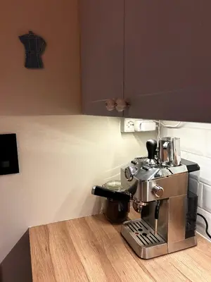a kitchen with a coffee maker on a counter at City View, stylish loft apartment and Central Location in Trondheim