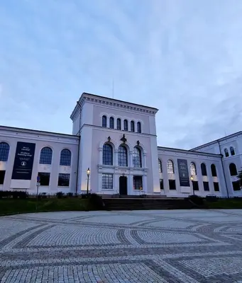 a large white building with a lot of windows at Sleep well in Heart of Bergen - Beautiful street in Bergen