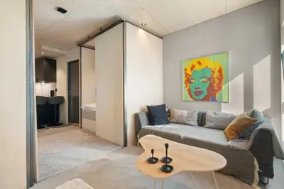 a living room with a couch and a table at The Double Date I Architectural Gem in Bergen