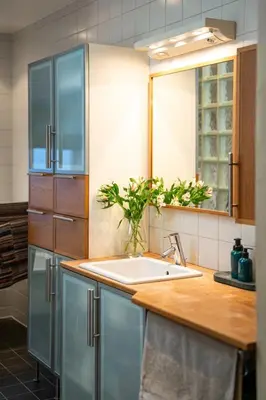 a kitchen with a sink and a counter at Cozy downtown apartment in Trondheim
