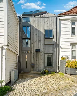 a house with a solarium on top of it at Bryggen Penthouse I NEW 2021 in Bergen