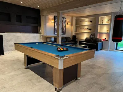 a living room with a pool table in it at Holiday Cabin with Hot Tub and Billiard Table in Tyndrom