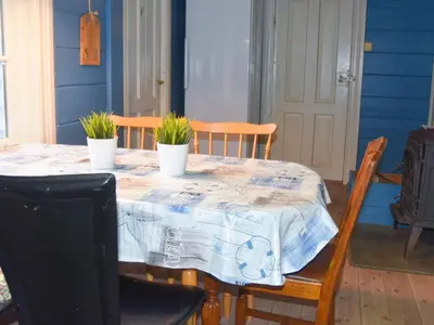 a table with three potted plants on top of it at 6 person holiday home in Fjørtoft in Fjørtoft