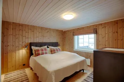 a bedroom with a bed and a window at Luxury And Comfort With Stunning Views in Beitostøl