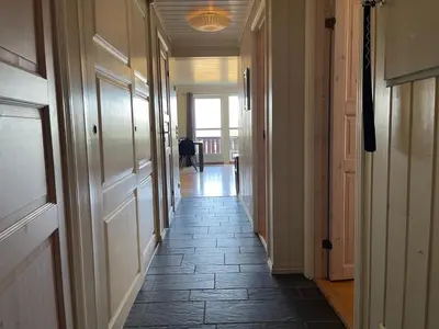 a hallway with a tile floor in a house at Family-Friendly Retreat With Fireplace And Balcony in Beitostøl