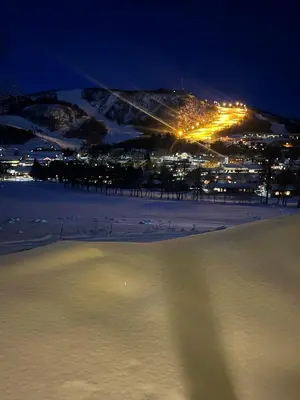 a view of a city at night in the snow at UNIQUE, Central Apartment at Geilo in Hol