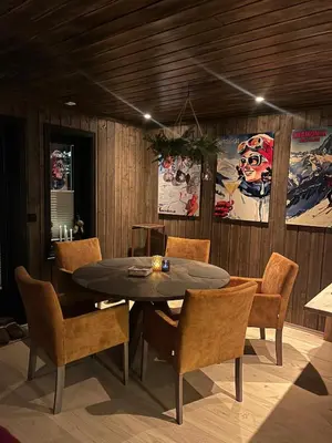 a dining room with a table and chairs at UNIQUE, Central Apartment at Geilo in Hol