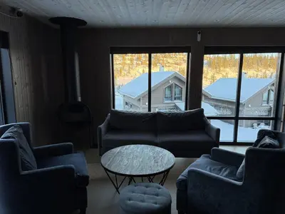 a living room with couches and a table at Kvitfjell Year-round destination-Ski in ski out - World Cup side in Strande