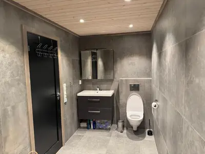 a bathroom with a toilet and a sink at Kvitfjell Year-round destination-Ski in ski out - World Cup side in Strande