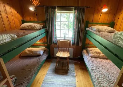 a room with two bunk beds and a chair at Trysilfjellet Nord 509 in Trysil