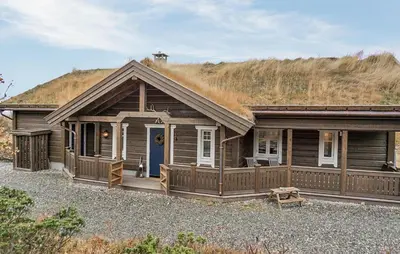 a wooden house with a grass roof at Amazing Home In Gålå With Sauna in Gålå