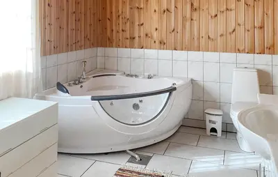 a white bath tub in a bathroom with a sink at Amazing Home In Rauland in Rauland