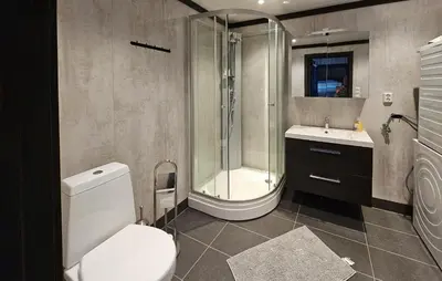 a bathroom with a shower and a toilet and a sink at 3 Bedroom Awesome Apartment In Rjukan in Rjukan