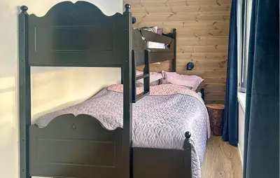 a bedroom with two bunk beds in a room at Awesome Home In Oppdal With Sauna in Oppdal