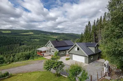 an aerial view of a house in the hills at FrysiaHouse in Lillehammer