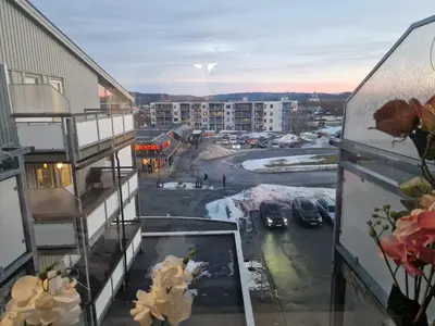 a view from the balcony of a apartment building at Flatåsensenteret in Kystad
