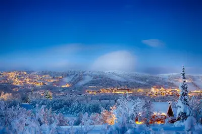 a view of a city in the snow at night at Family-Friendly Stay Near Ski Trails! in Beitostøl