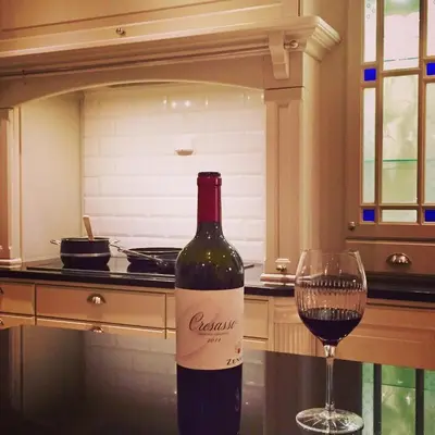 a bottle of wine sitting next to a wine glass at Exclusive villa in Trondheim in Trondheim